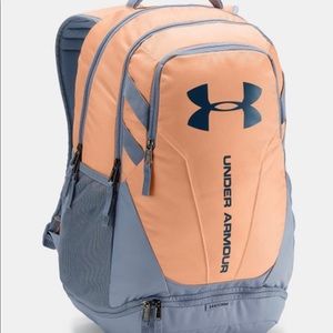 Coral and gray Under Armour backpack.